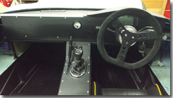 Centre console panel in place with handbrake slot covered - Click for larger image
