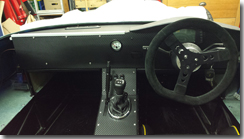 Centre console panel in place with handbrake slot covered - Click for larger image