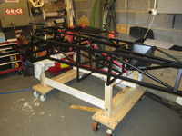 Chassis turned over to allow for drilling of the floor panels - Click for larger image
