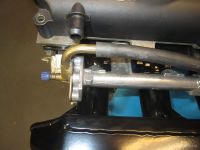 Original connector on fuel rail blocking the breather on the CAM cover - Click for larger image